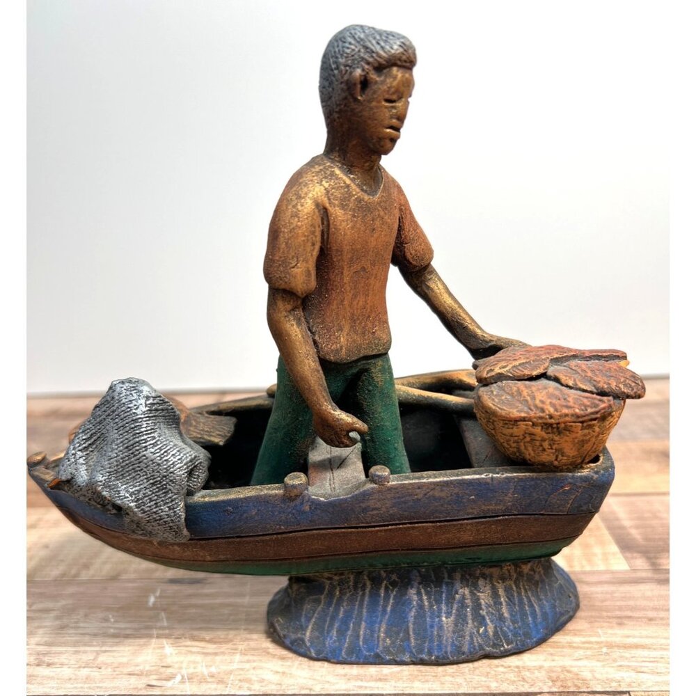 Clay Fisherman Figurine On Boat With Net & Basket